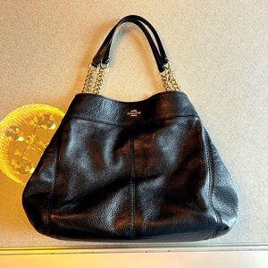 Black coach purse with gold chain handles